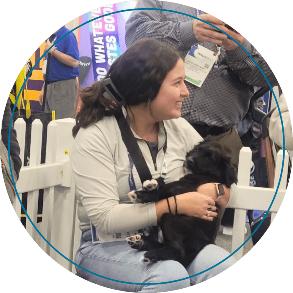 Allison Snead at the "Puppy Petting Corner" at PPAI Expo