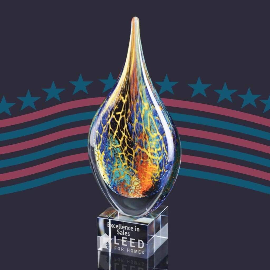 A custom marbled tear drop-shaped award that is made in the USA