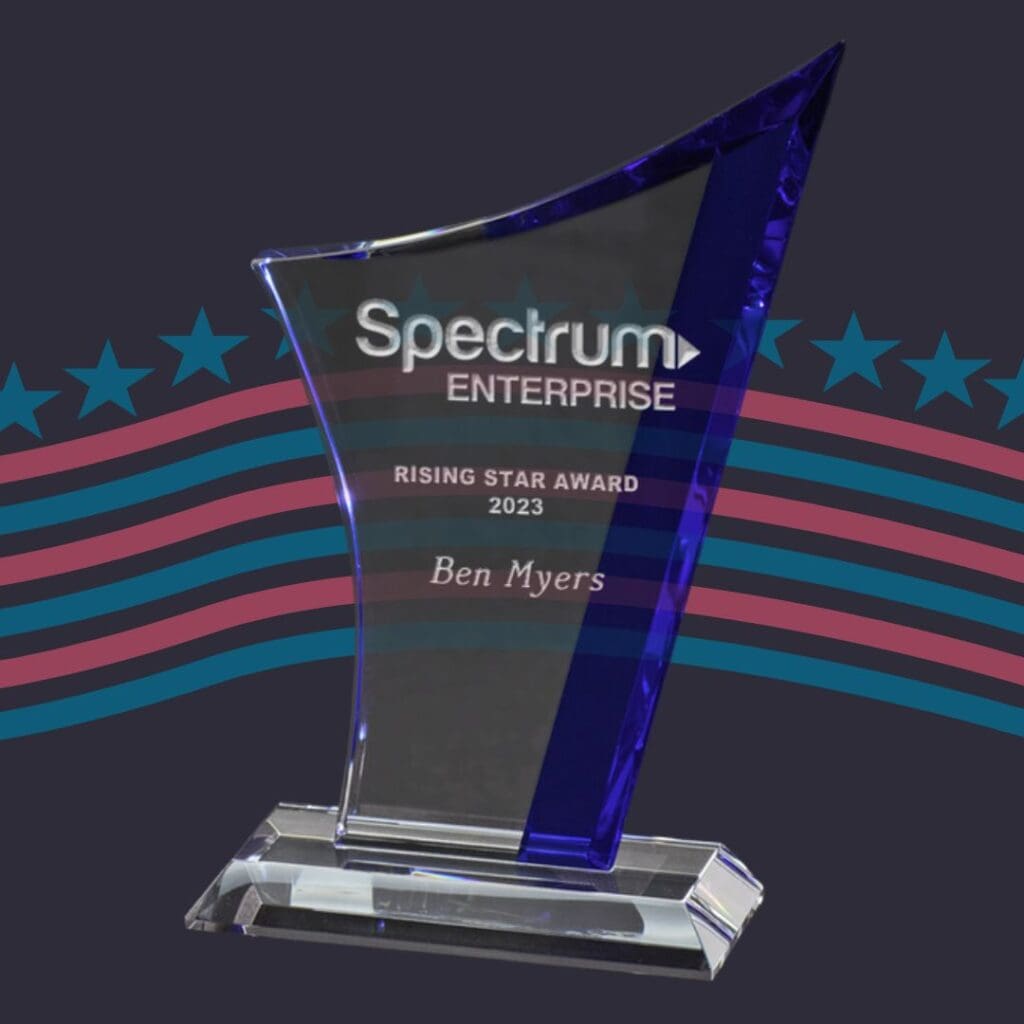 A custom clear and blue glass award that is made in the USA