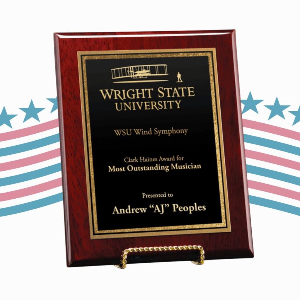 A wooden and aluminum plaque that is made in the USA