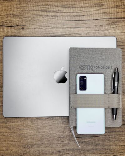 Don’t sweat last-minute meetings with the Council Textured Journal! This helpful journal features an elastic band to hold your phone and pen whenever you’re on-the-go.